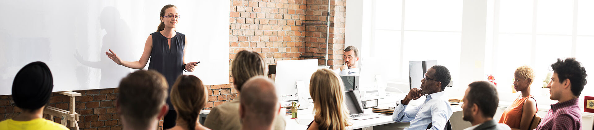 Person presenting to a class.